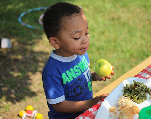 A boy eating an apple