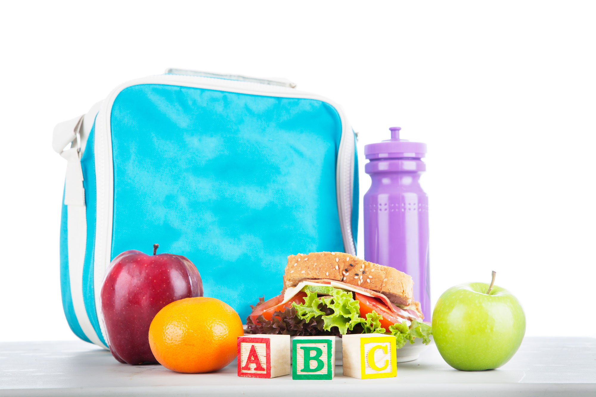 A bag, a bottle, mixed fruits and vegetables